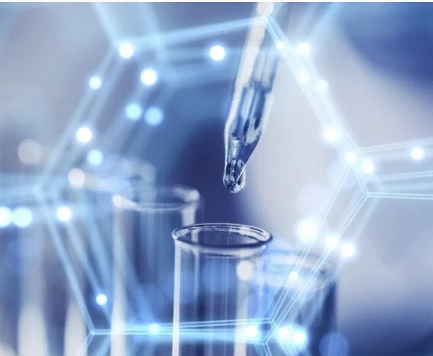 Clinical research — pipette dispensing a sample into test tubes